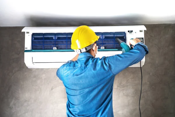 depositphotos_379064420-stock-photo-technician-man-repairing-cleaning-maintenance